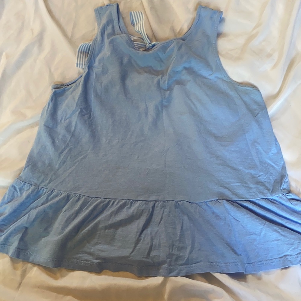 Blue peplum shirt with bow on back